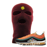 Embroidered on the front of the maroon Air Max 97 Sunburst sneaker matching maroon ski mask is the Vintage Lion Head logo