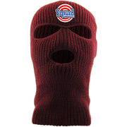 Embroidered on the forehead of the maroon squad ski mask is the squad logo in red, white, and blue