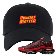 Embroidered on the front of the air max plus sunburst sneaker matching black dad hat is the runners matter logo