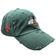 embroidered on the right side of the honey bee hunter green distressed dad hat is a foot clan bonsai tree embroidered in red