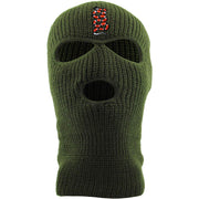 Embroidered on the forehead of the olive coiled snake ski mask is the snake logo in red, white, and black