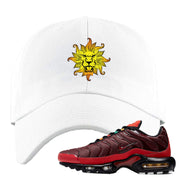 Embroidered on the front of the air max plus sunburst sneaker matching white dad hat is the vintage lion head logo