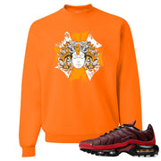 printed on the front of the air max plus sunburst sneaker matching orange crewneck sweatshirt is the medusa sunburst logo