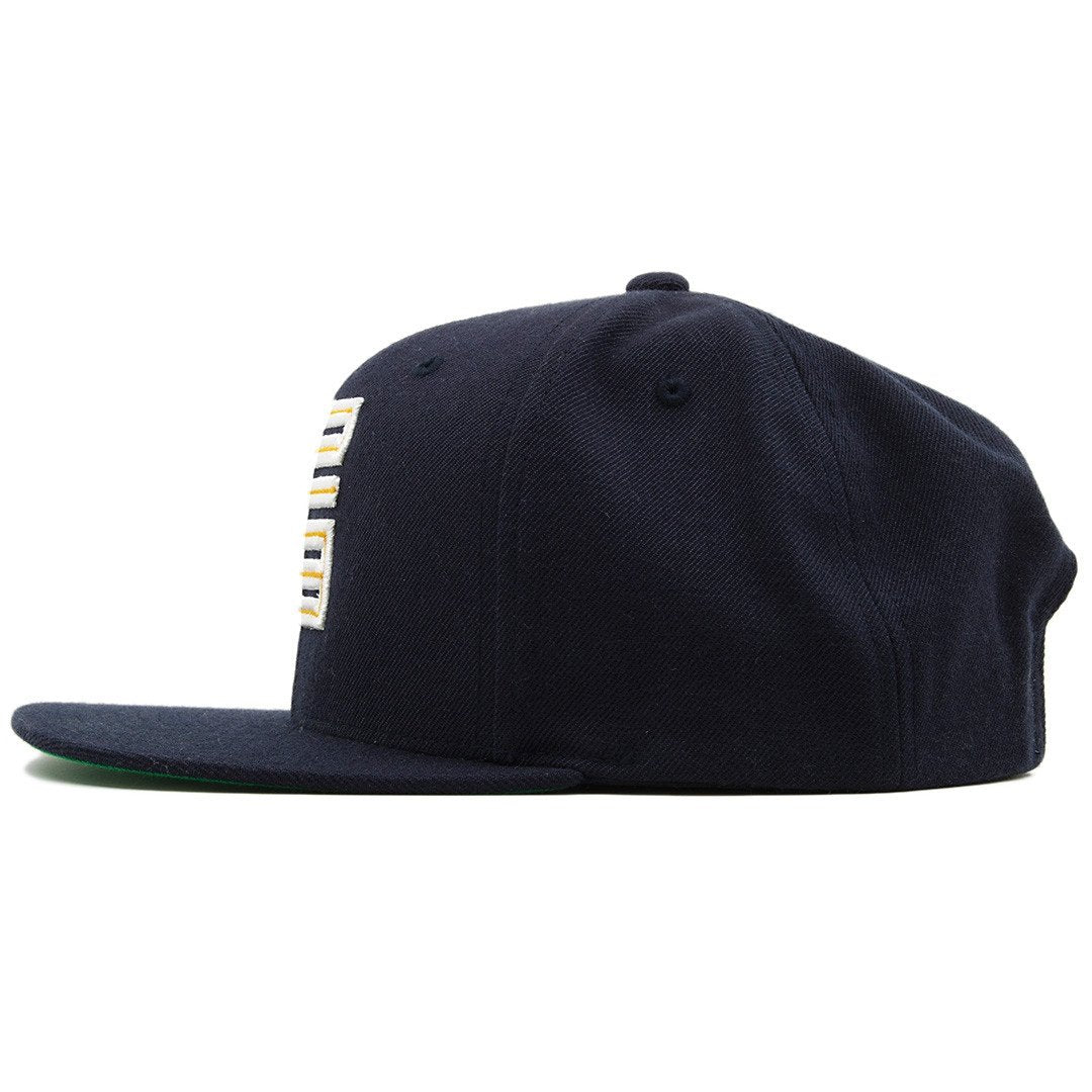 the dunk from above jordan 4 matching snapback hat is solid navy blue