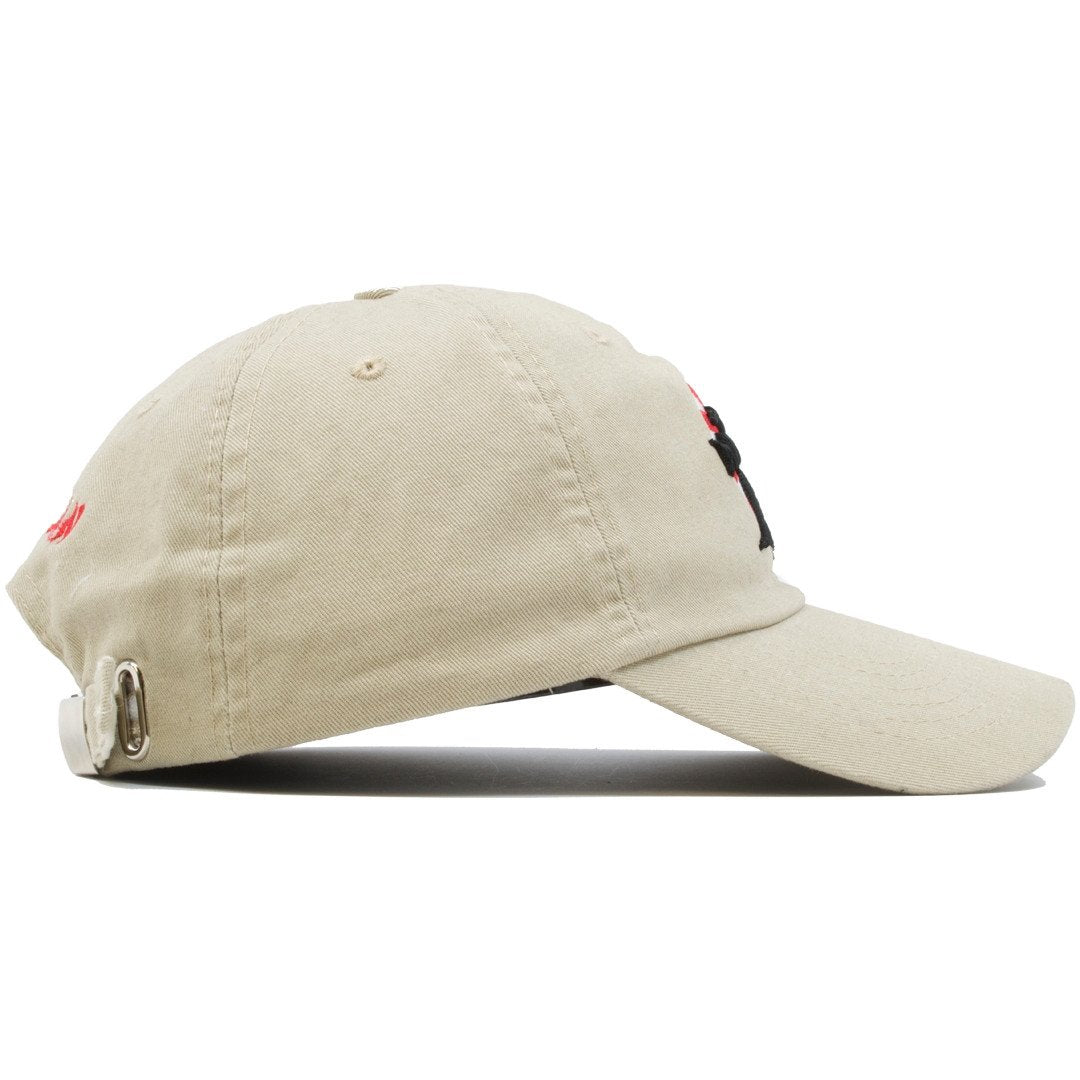 The Foot Clan Bonsai Tree Rising Sun Dad Hat is khaki and made of 100% cotton with a soft crown and bent brim.