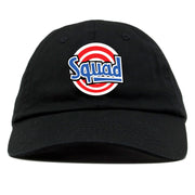on the front of the space jam tune squad black dad hat, the squad logo is embroidered in red, white, and blue