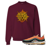 Printed on the front of the Air Max 97 Sunburst maroon sneaker matching crewneck sweatshirt is the Vintage Lion Head logo