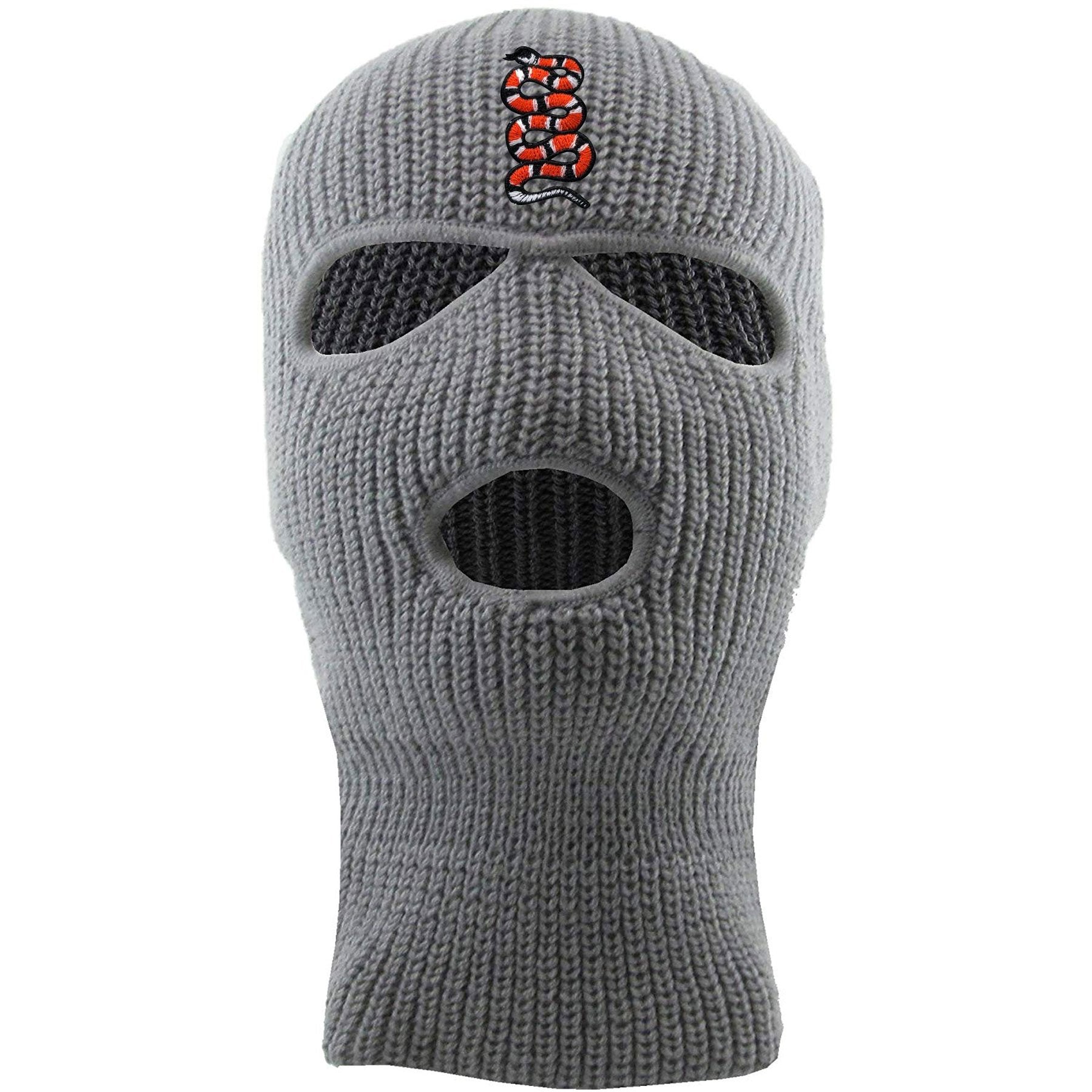 Embroidered on the forehead of the light gray coiled snake ski mask is the snake logo in red, white, and black